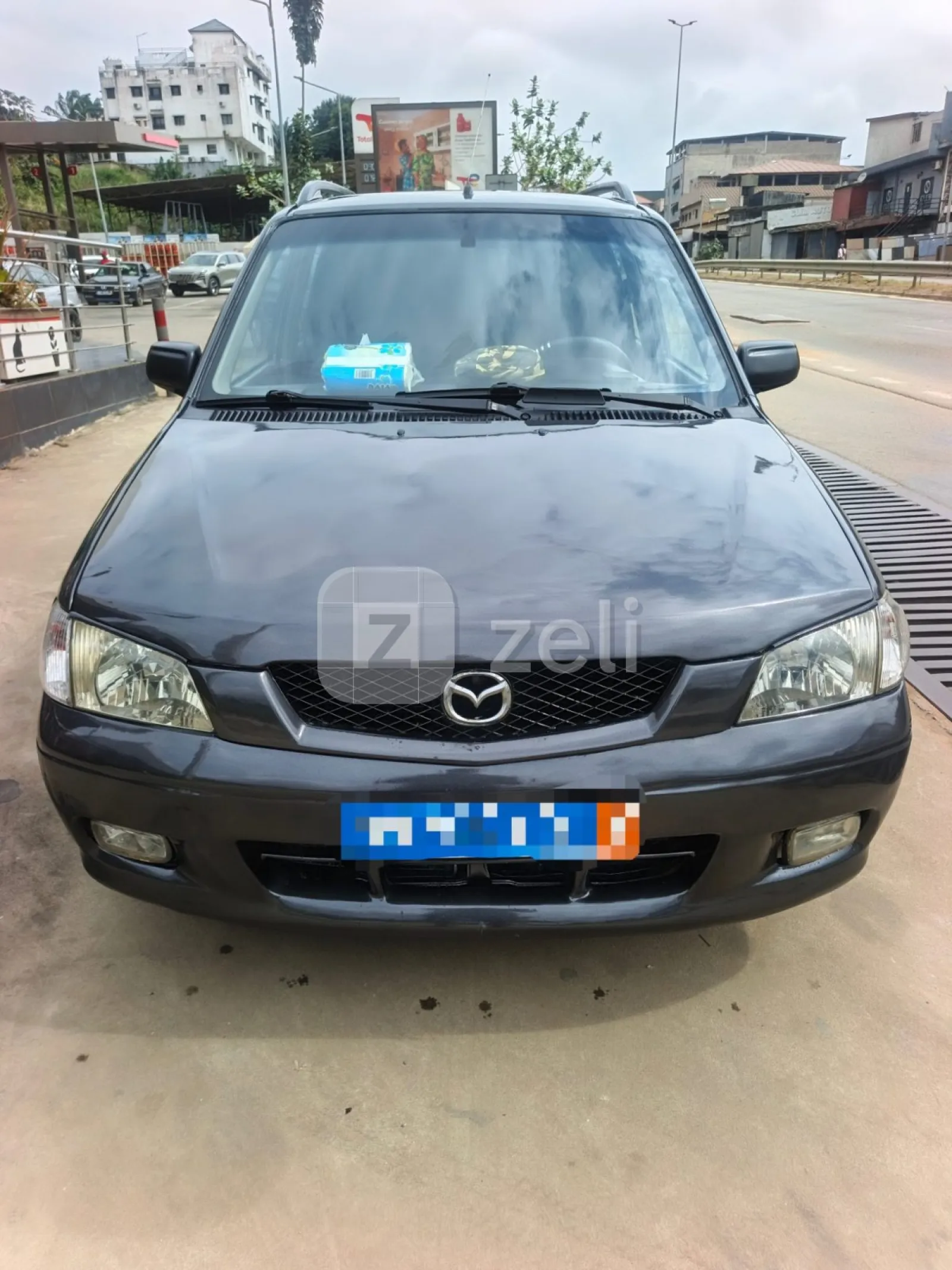 Mazda Demio 2004 — photo 1