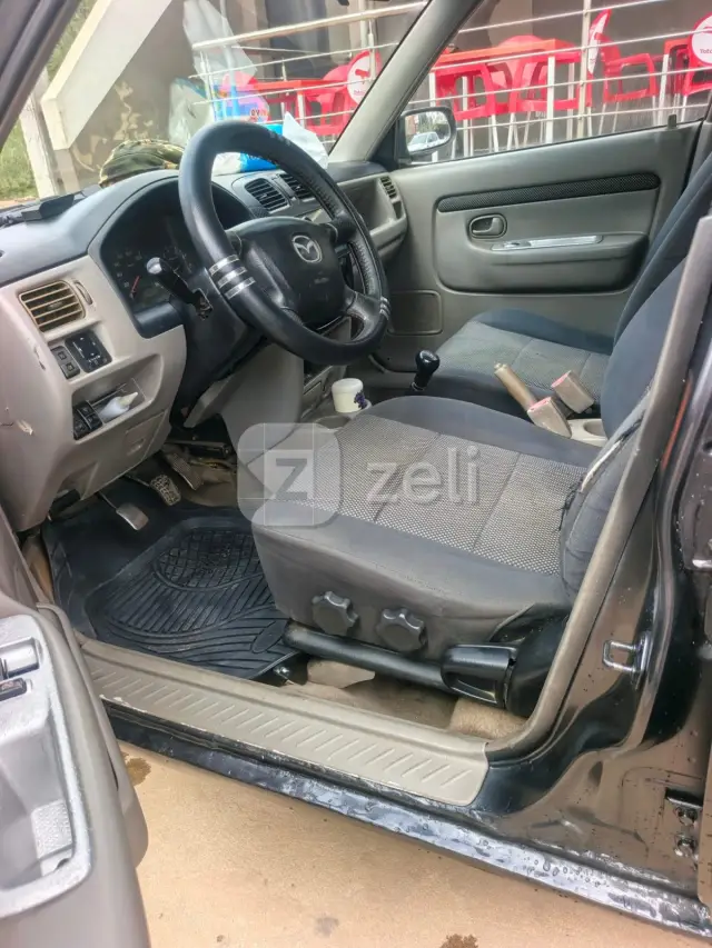 Mazda Demio 2004 — photo 8