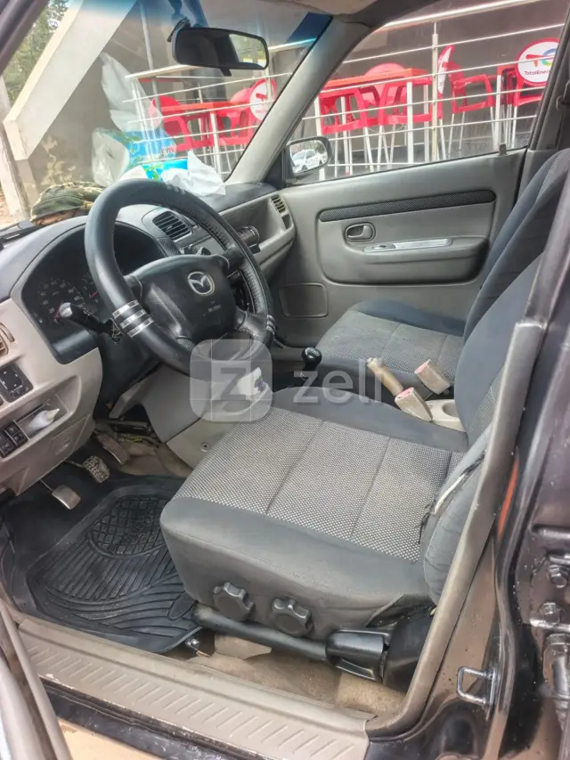 Mazda Demio 2004 — photo 10